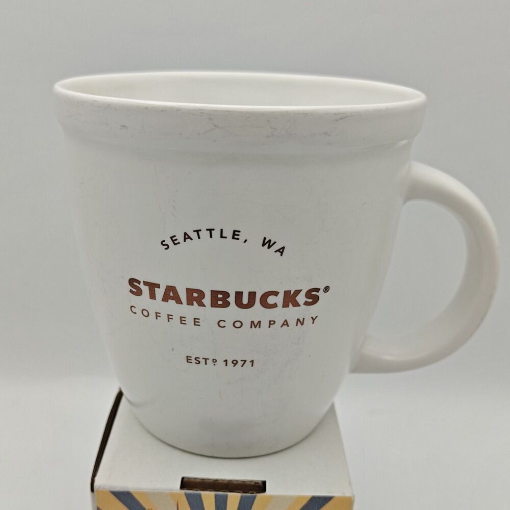 2016 Starbucks Coffee Mug White with Bronze Lettering 16 oz Seattle, WA EST 1971